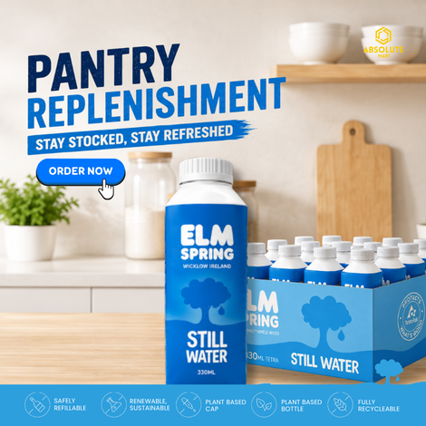 Elm Spring water bottles and packaging on a kitchen counter with promotional text.